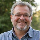 Happy client Mark S. smiling, looking energetic and recovered from fatigue.